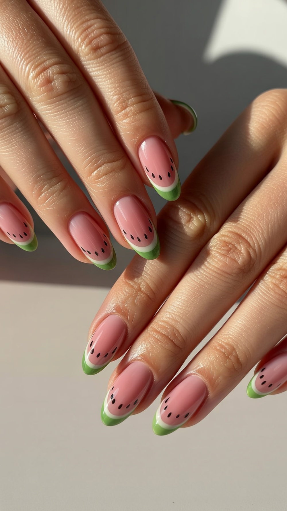 Classic pink and green French tip watermelon nail art with detail