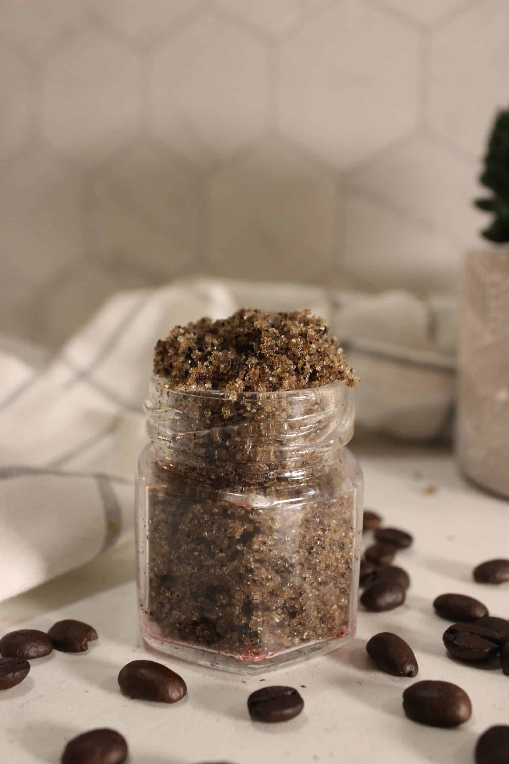 Rich coffee sugar scrub in a glass jar.